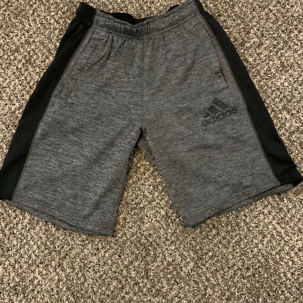 Adidas fleece shorts with zipper pockets.